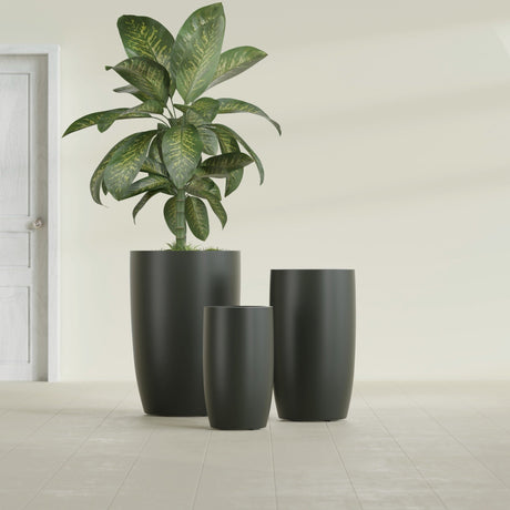 Lisbon Tall Round fiberglass planter in Matte Charcoal, size range, in a sunlit interior