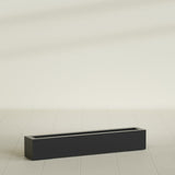 Salon Box Planter in Matte Black, 48" Long, shown empty