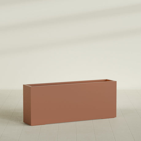 Hollywood Narrow Rectangular Planter in Matte Terra Cotta, 60"L × 12"D × 24"H, shown empty