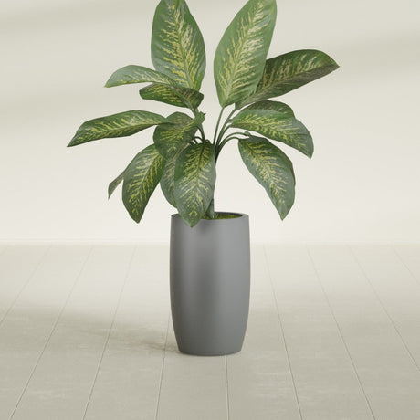 Lisbon Tall Round fiberglass planter in Matte Gunmetal, shown planted, in a sunlit interior