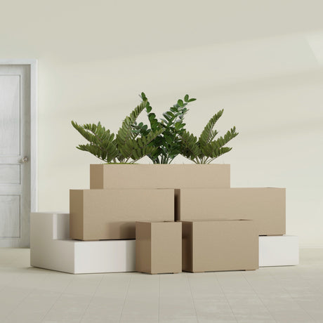 Tolga Corner fiberglass planter in Gloss Metallic Gold, size range, in a sunlit interior