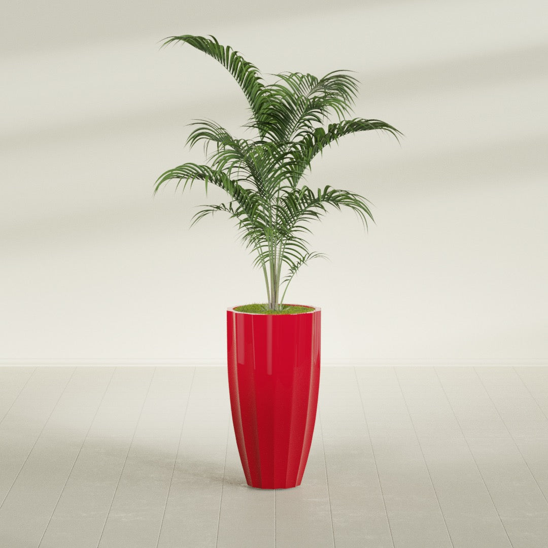 San Jose Tall Fluted fiberglass planter in Gloss Red, shown planted, in a sunlit interior