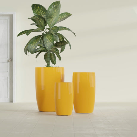 Lisbon Tall Round fiberglass planter in Gloss Saffron, size range, in a sunlit interior