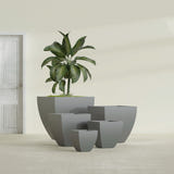 Lima Tapered Square fiberglass planter in Matte Gunmetal, size range, in a sunlit interior