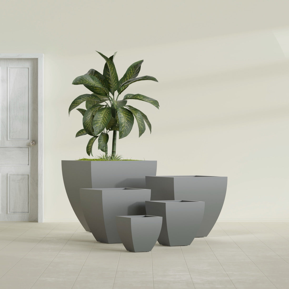Lima Tapered Square fiberglass planter in Matte Gunmetal, size range, in a sunlit interior