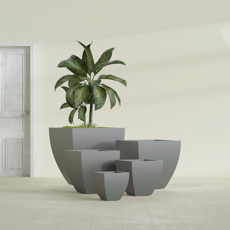 Lima Tapered Square fiberglass planter in Matte Gunmetal, size range, in a sunlit interior