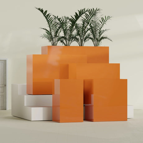 Darwin Corner fiberglass planter in Gloss Tangerine, size range, in a sunlit interior