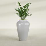 Barà Jar fiberglass planter in Metallic Silver, shown planted, in a sunlit interior