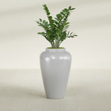 Barà Jar fiberglass planter in Metallic Silver, shown planted, in a sunlit interior