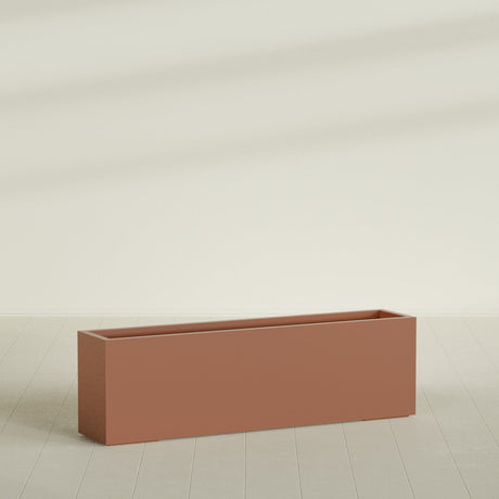 Miami Narrow Rectangular Planter in Matte Terra Cotta, 60"L × 12"D × 18"H, shown empty
