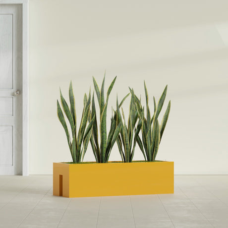 Tiergarden Railing fiberglass planter in Gloss Saffron, shown planted, in a sunlit interior