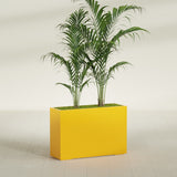 Potsdam Corner fiberglass planter in Gloss Saffron, shown planted, in a sunlit interior