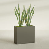 Perth Corner fiberglass planter in Matte Bronze, shown planted, in a sunlit interior