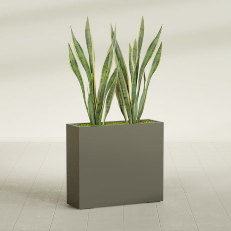 Perth Rectangular fiberglass planter in Matte Bronze, shown planted, in a sunlit interior