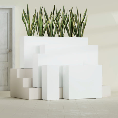 Delray Corner fiberglass planter in Gloss Bright White, size range, in a sunlit interior