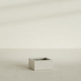 Antwerp corner fiberglass planter in Matte Cement Grey (shown in Satin Beige; color approximate)