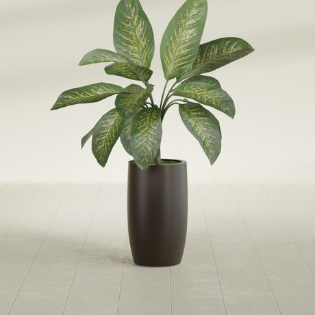 Lisbon Tall Round fiberglass planter in Matte Dark Brown, shown planted, in a sunlit interior