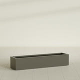 Cuba Low Rectangular Planter in Matte Bronze, 60"L × 14"D × 12"H, shown empty