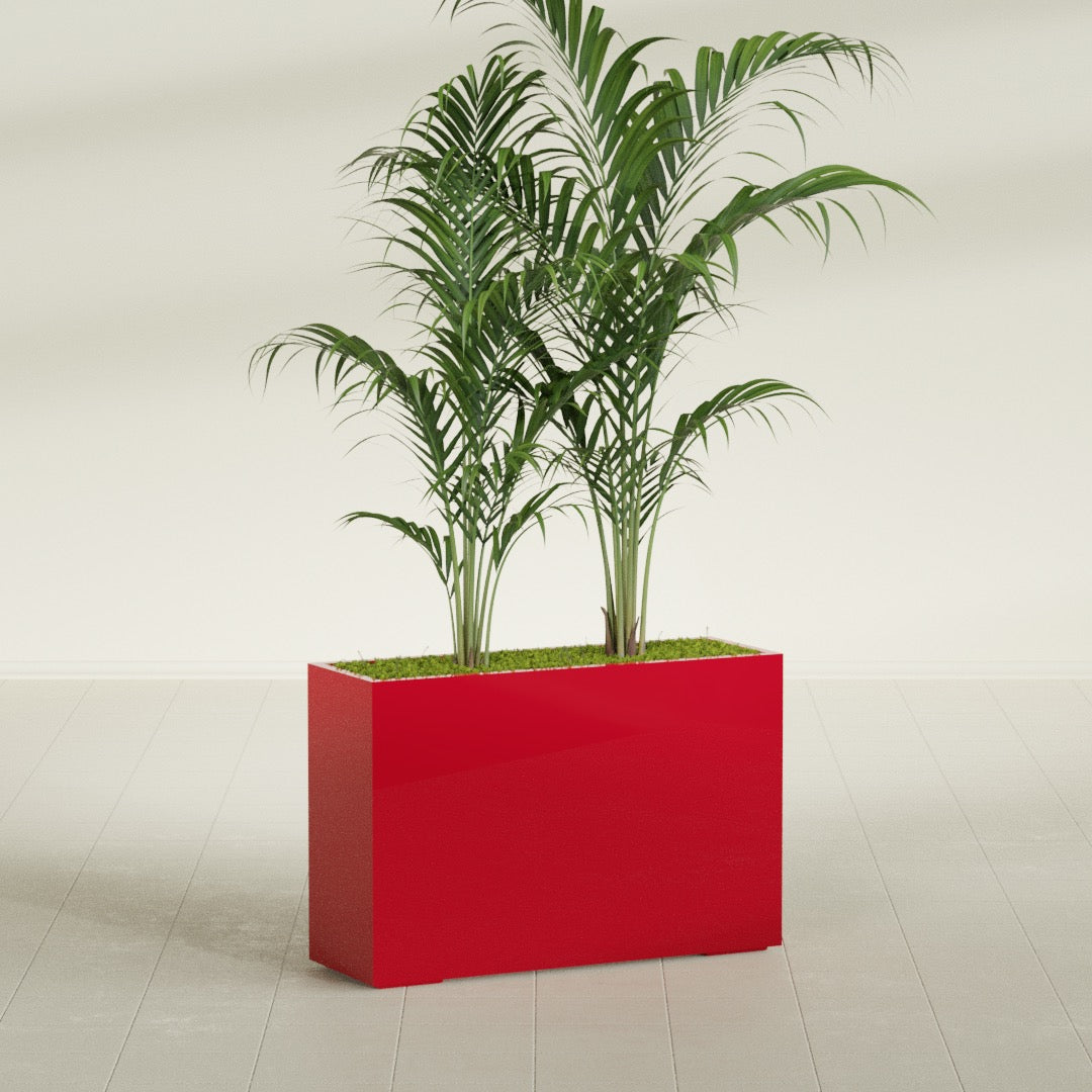 Potsdam Corner fiberglass planter in Gloss Red, shown planted, in a sunlit interior