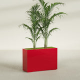 Potsdam Corner fiberglass planter in Gloss Red, shown planted, in a sunlit interior
