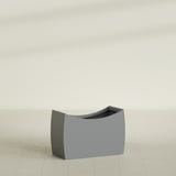Seoul Curved Planter in Matte Gunmetal, 36"L × 16"D × 24"H, shown empty
