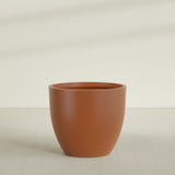 Wannsee Round Planter in Matte Terra Cotta, 50"D × 44"H, shown empty