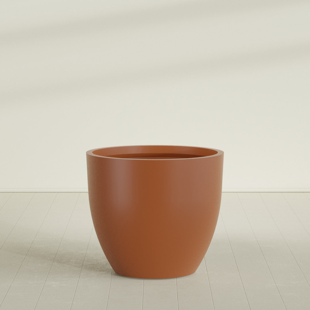 Wannsee Round Planter in Matte Terra Cotta, 50"D × 44"H, shown empty