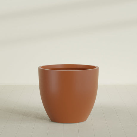 Wannsee Round Planter in Matte Terra Cotta, 50"D × 44"H, shown empty