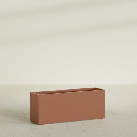 Tolga Rectangular Planter in Matte Terra Cotta, 60"L × 16"D × 24"H, shown empty