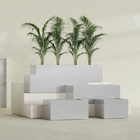 Torino Corner fiberglass planter in Metallic Silver, size range, in a sunlit interior