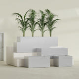 Torino Wide Rectangular fiberglass planter in Metallic Silver, size range, in a sunlit interior