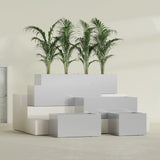 Torino Wide Rectangular fiberglass planter in Metallic Silver, size range, in a sunlit interior