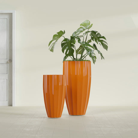 San Jose Tall Fluted fiberglass planter in Gloss Tangerine, size range, in a sunlit interior