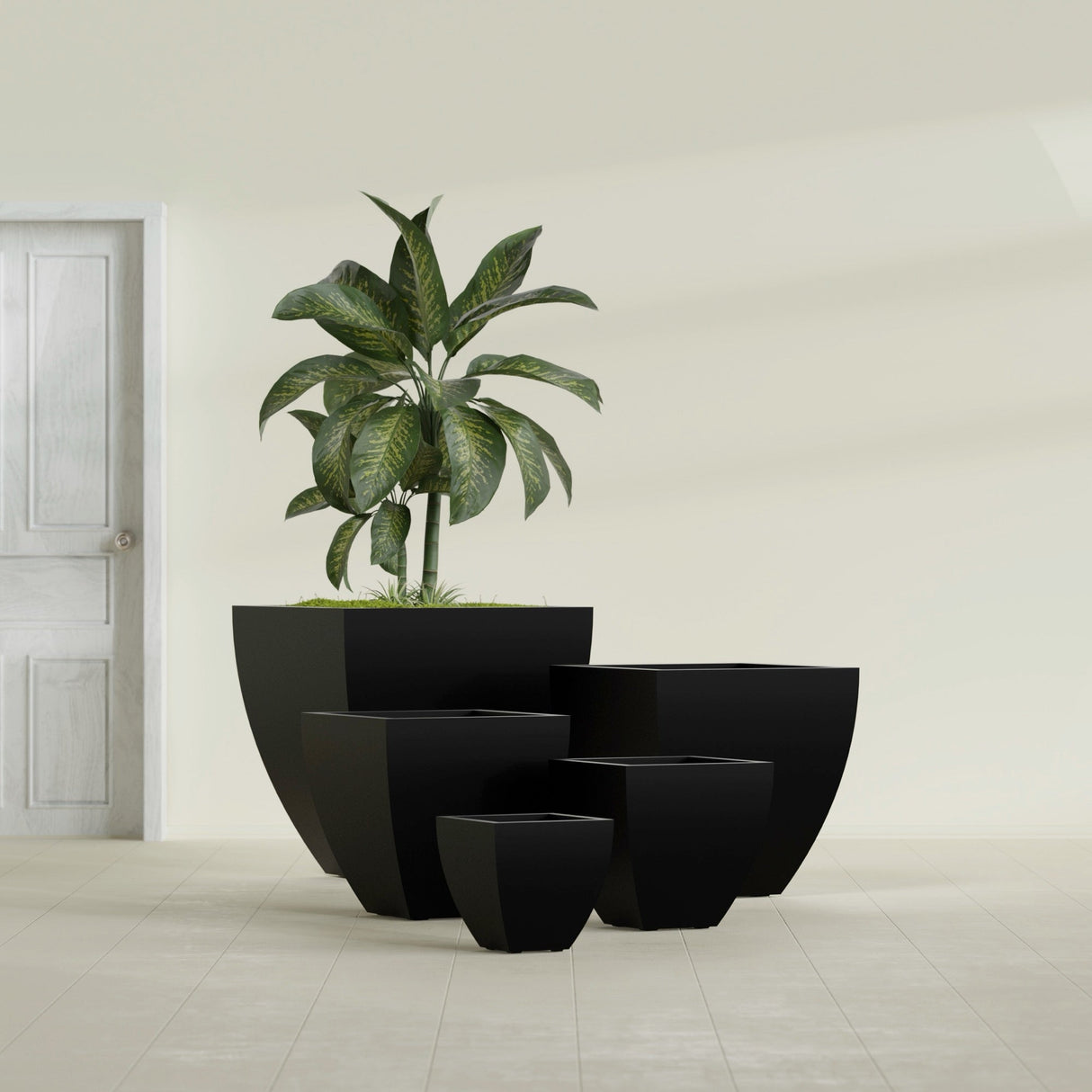 Lima Tapered Square fiberglass planter in Matte Black, size range, in a sunlit interior