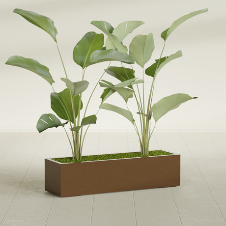 Cuba Corner fiberglass planter in Metallic Bronze, shown planted, in a sunlit interior