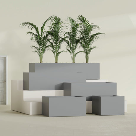 Torino Wide Rectangular fiberglass planter in Matte Gunmetal, size range, in a sunlit interior