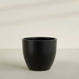 Wannsee Round Planter in Matte Black, 50"D × 44"H, shown empty