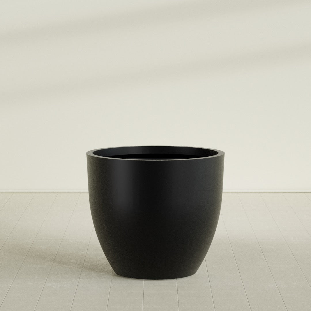 Wannsee Round Planter in Matte Black, 50"D × 44"H, shown empty