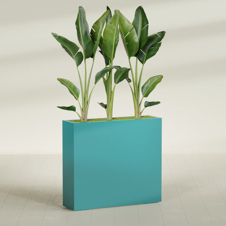 Amesbury Narrow Rectangular fiberglass planter in Satin Seafoam Green, shown planted, in a sunlit interior