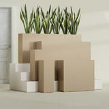 Delray Corner fiberglass planter in Gloss Metallic Gold, size range, in a sunlit interior