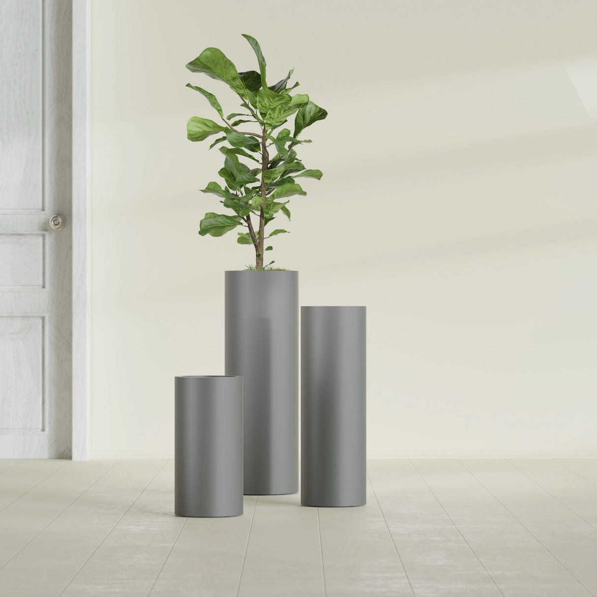 Corry Cylinder fiberglass planter in Matte Gunmetal, size range, in a sunlit interior