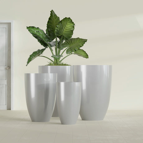 Brannan Tapered Round fiberglass planter in Metallic Silver, size range, in a sunlit interior