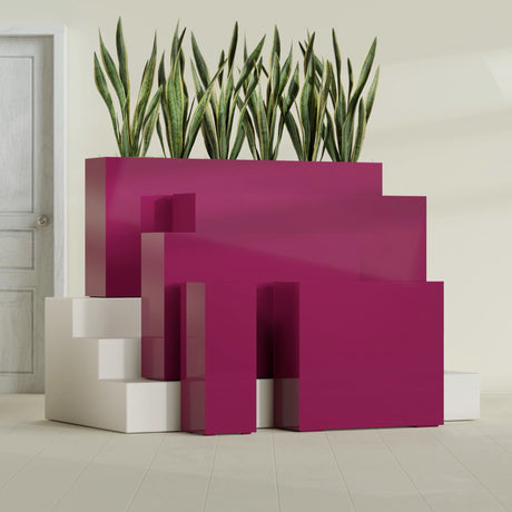 Delray Corner fiberglass planter in Gloss Eggplant, size range, in a sunlit interior