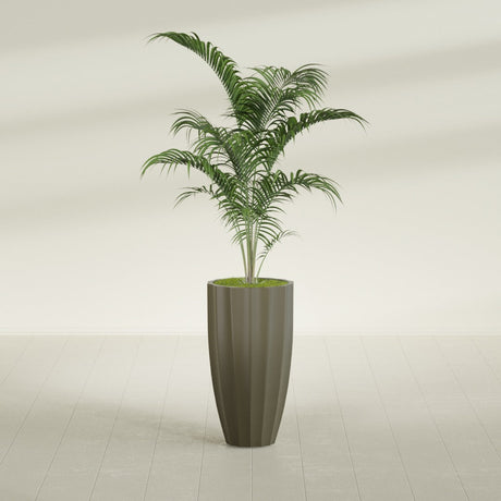 San Jose Tall Fluted fiberglass planter in Matte Bronze, shown planted, in a sunlit interior