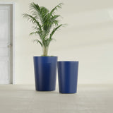 Tegel Round Tapered fiberglass planter in Matte Cobalt Blue, size range, in a sunlit interior