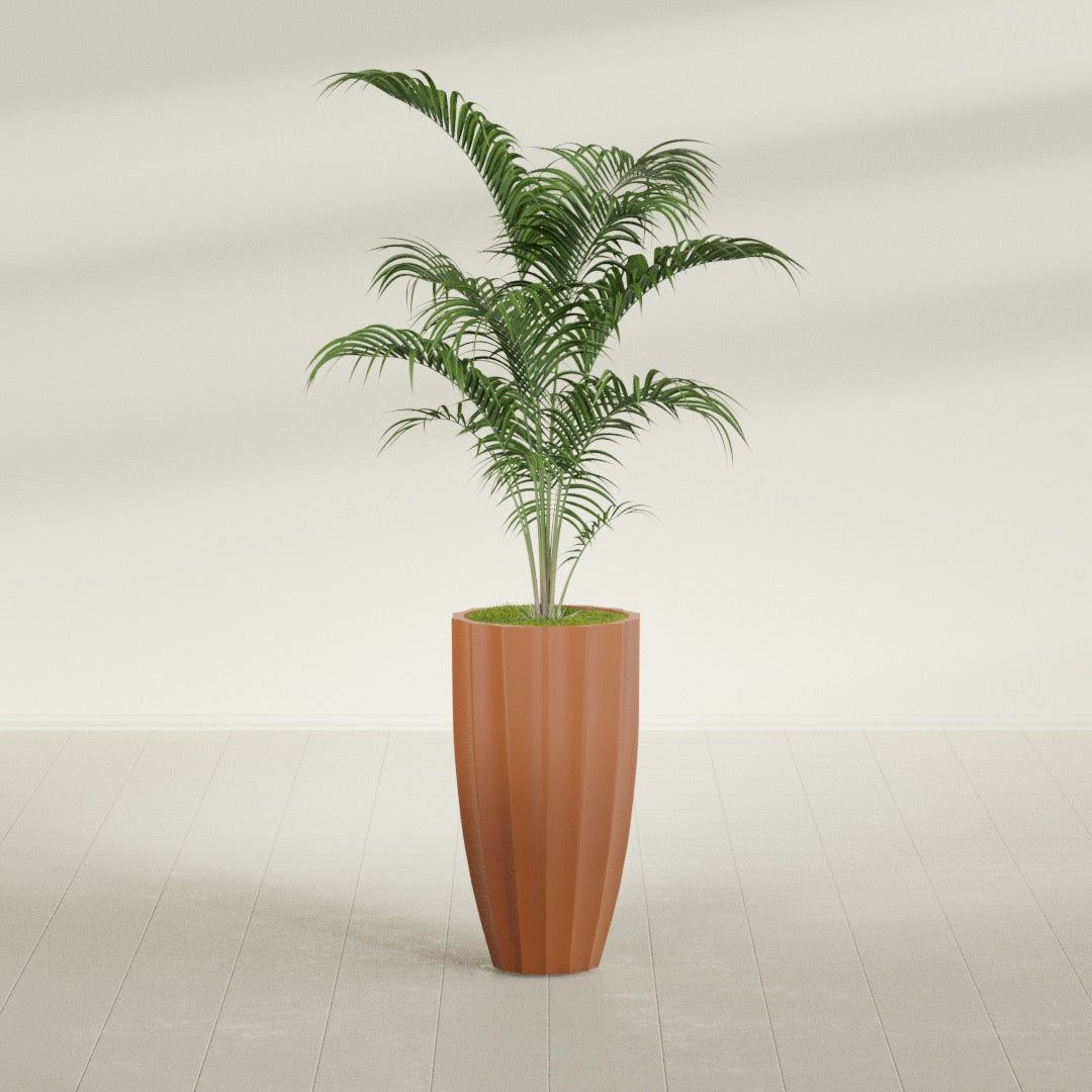 San Jose Tall Fluted fiberglass planter in Matte Terra Cotta, shown planted, in a sunlit interior