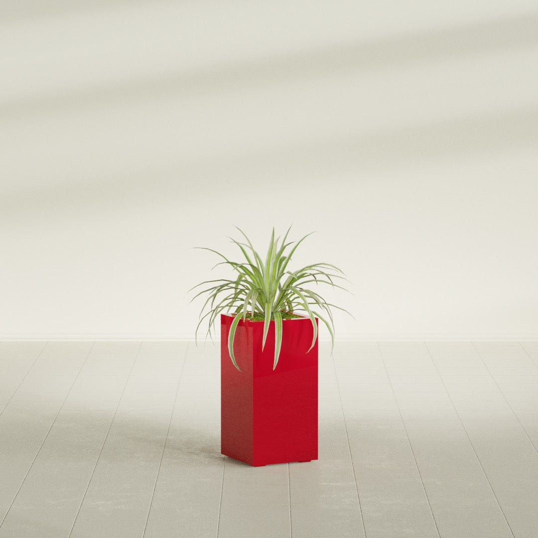 Hollywood Narrow Rectangular fiberglass planter in Gloss Red, shown planted, in a sunlit interior