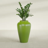 Barà Jar fiberglass planter in Satin Green, shown planted, in a sunlit interior