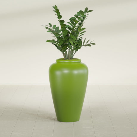 Barà Jar fiberglass planter in Satin Green, shown planted, in a sunlit interior