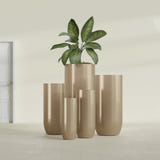 Saint Tropez Bullet Round fiberglass planter in Gloss Metallic Gold, size range, in a sunlit interior